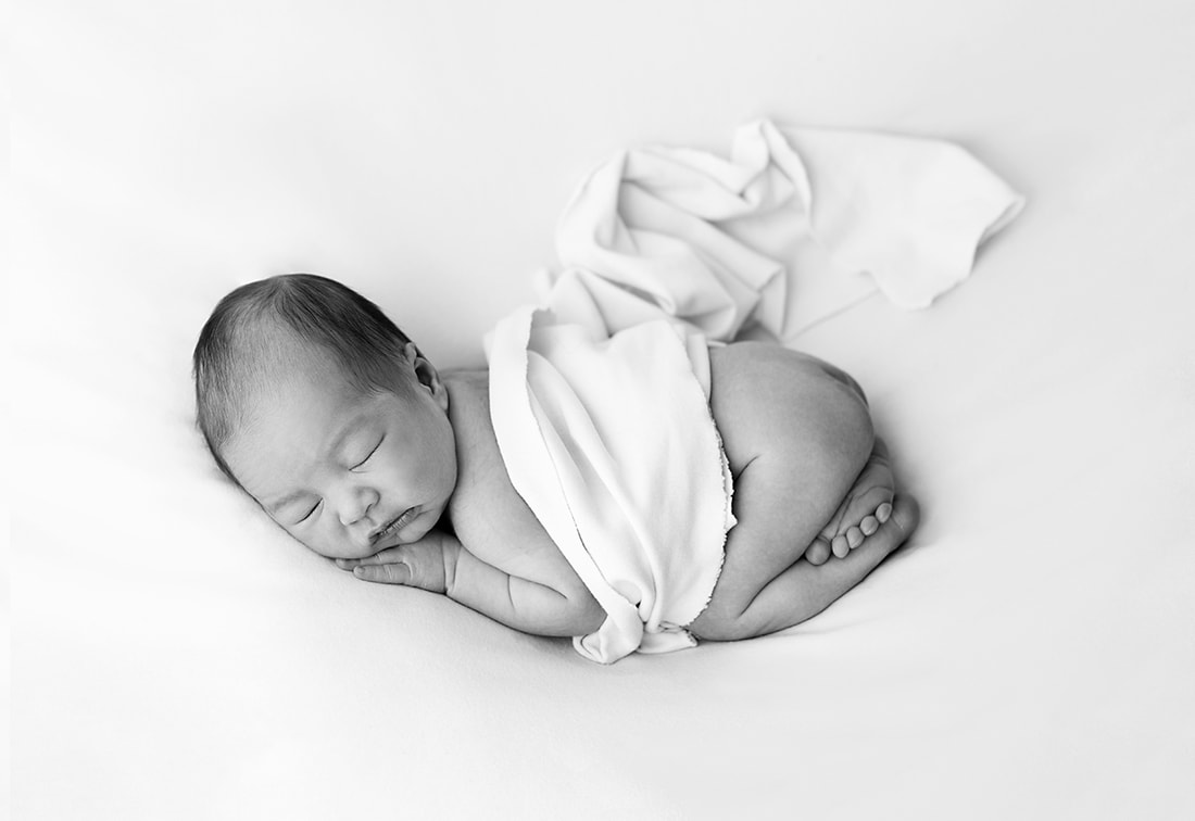 Black and white image of baby boy 9 days old