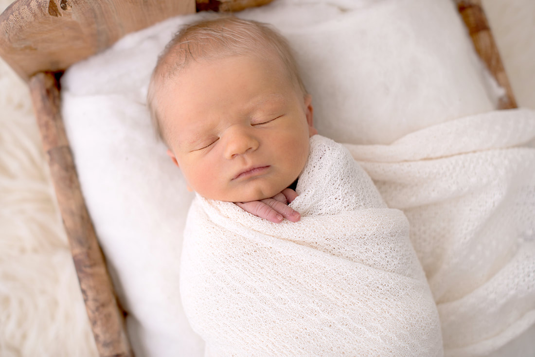 9 day old boy during his newborn photography session in Stockport