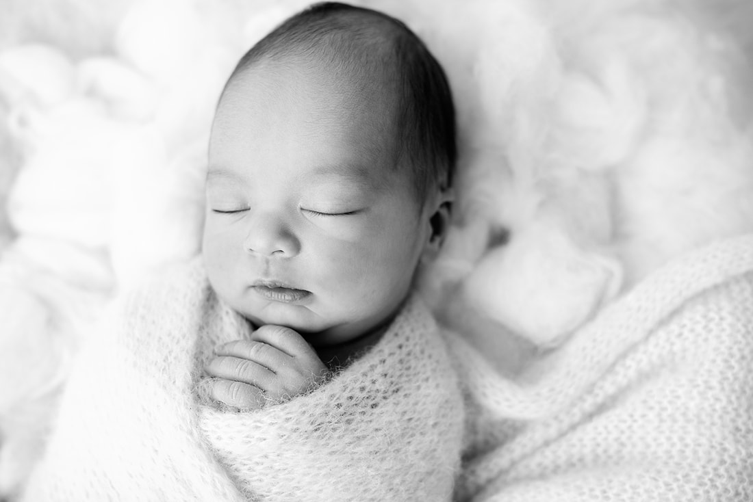 black and white image of baby boy in Cheadle studio